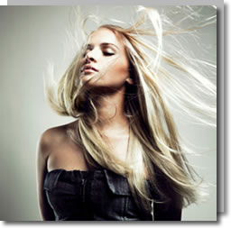 Long straight blonde hair in motion — the kind of finish Japanese straightening is known for